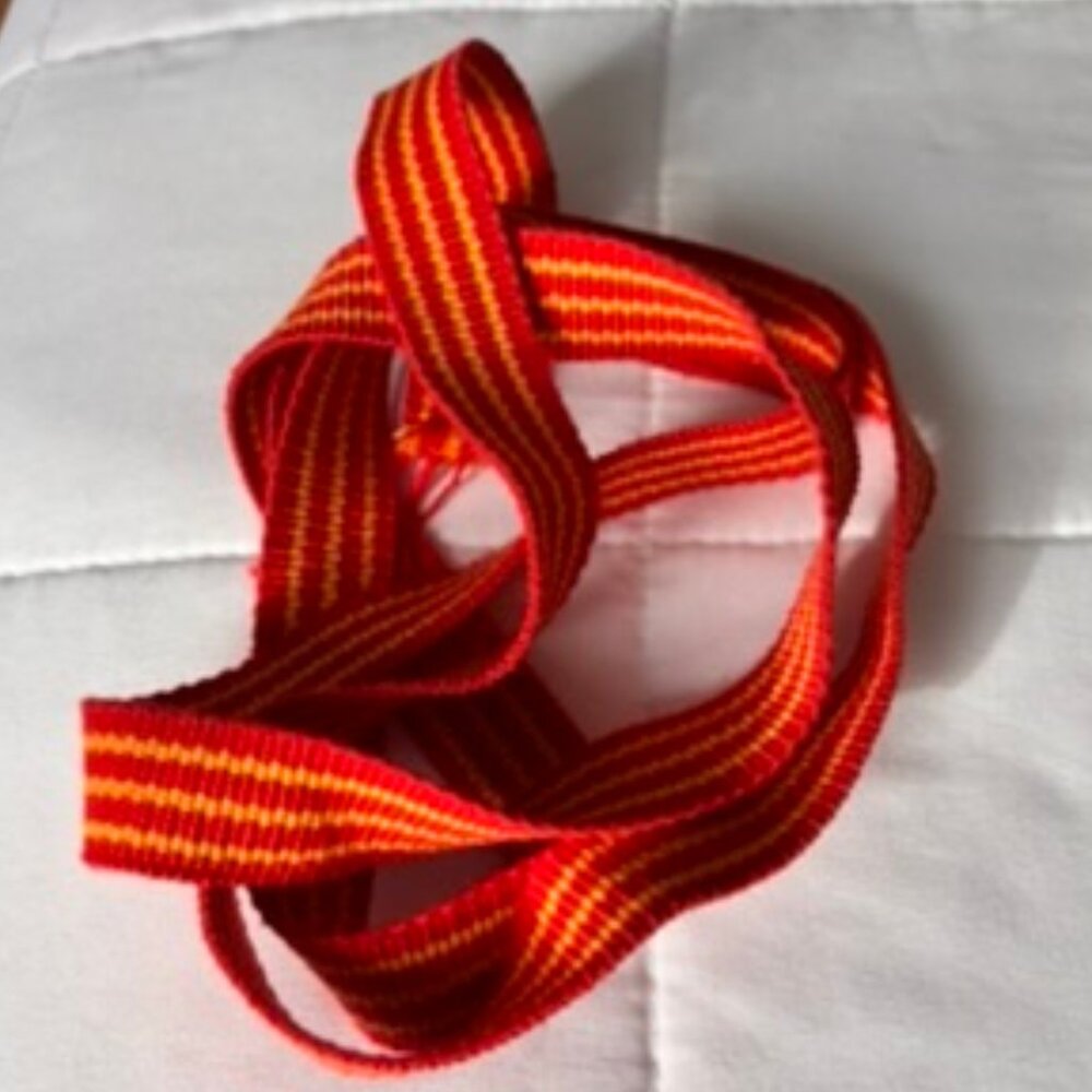 Vintage red and yellow webbing belting piece